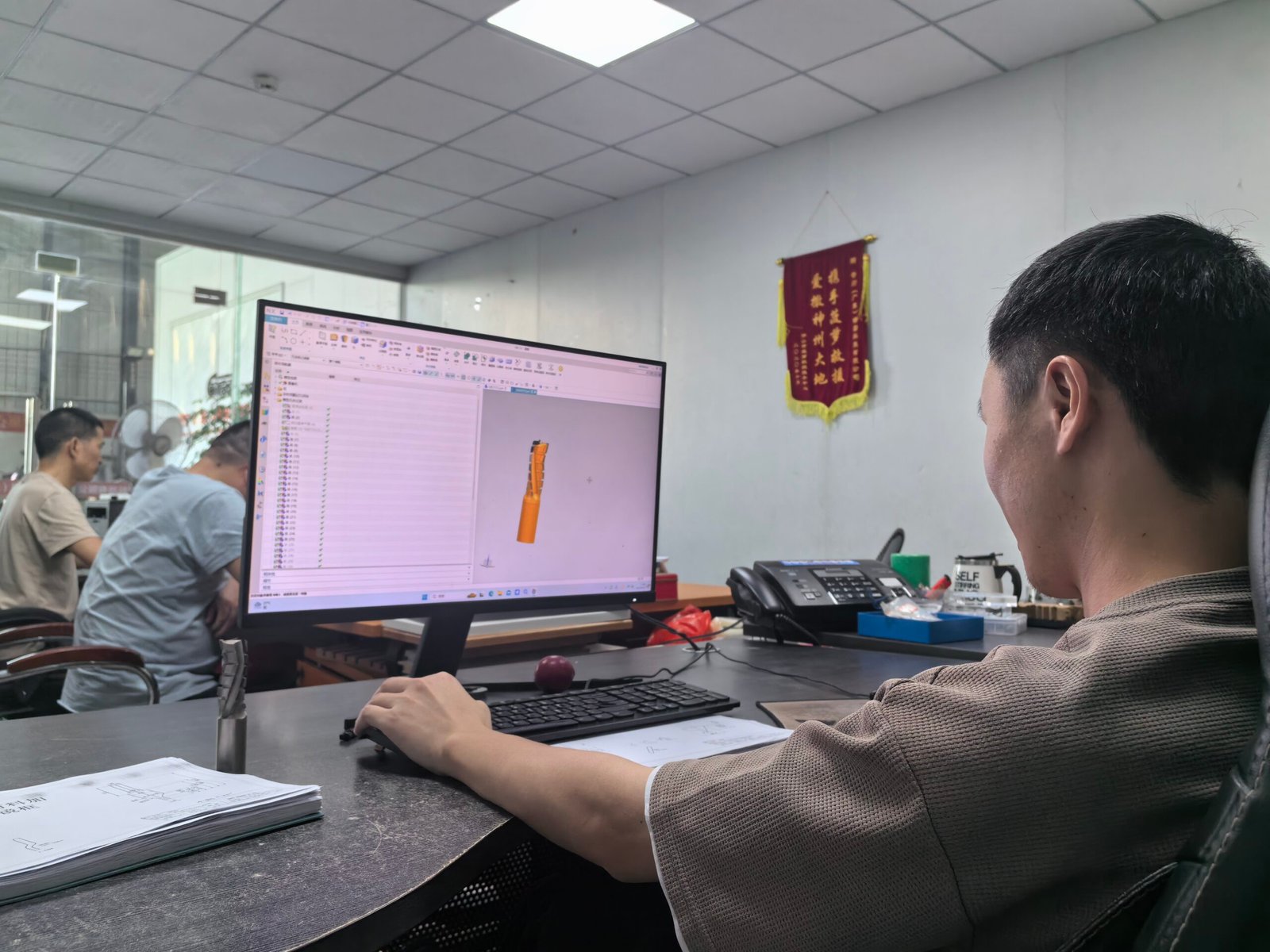 Engineer reviewing a 3D woodworking cutter design